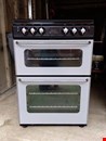 Gas cooker with double oven and lid